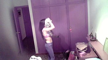 Beautiful spanish changing clothes in the room