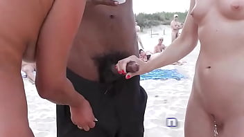 Naomi and her gf jerk off voyeurs on public beach